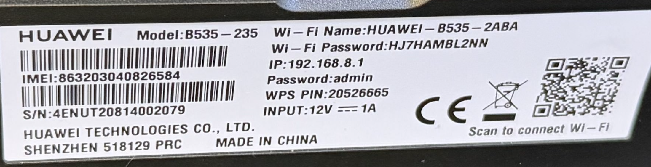 Close-up of the Huawei B535-235 back sticker showing WiFi name, WiFi password, IP address, and admin password